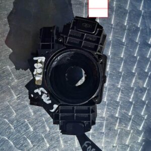 Front view of a Ford Focus combination switch with stalk levers and connector plug visible.Front view of a For