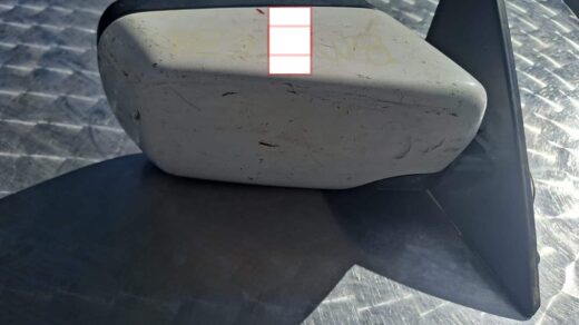 Right side car door mirror viewed from front angle, showing glass and black plastic housing.Right side car doo