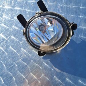 Left side headlight for BMW F30 shown angled from front with clear lens and reflector visible.Left side headli