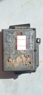 Top-down view of a Peugeot 3L V6 engine control unit with visible connectors, clean exterior.Top-down view of