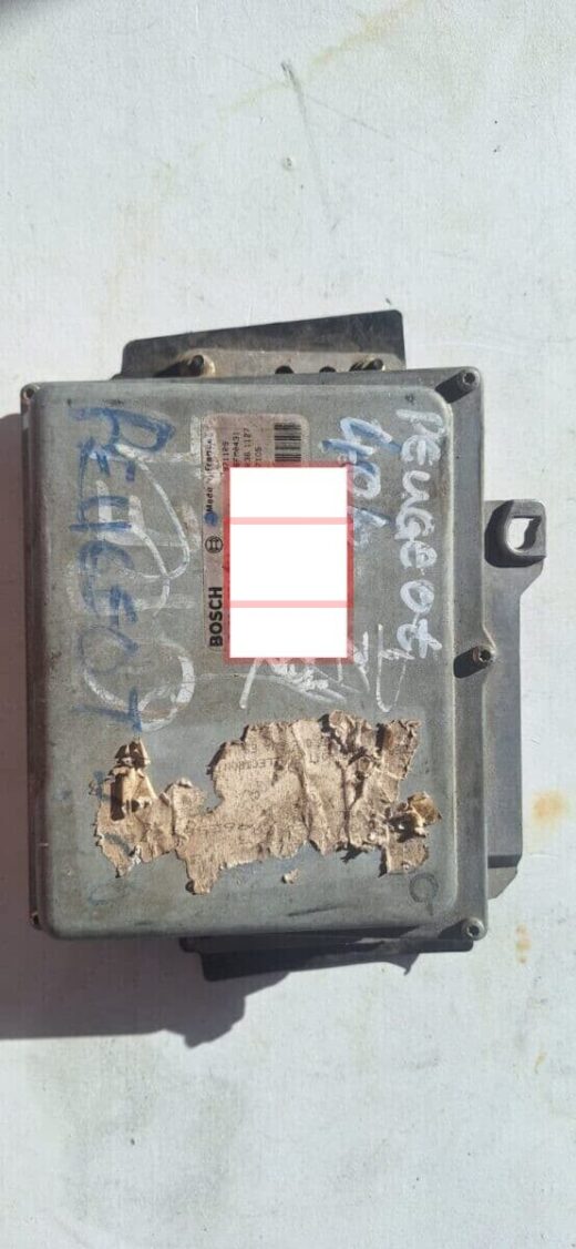 Top-down view of a Peugeot 3L V6 engine control unit with visible connectors, clean exterior.Top-down view of