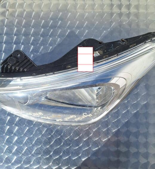 Hyundai Grand I10 Left Headlight Front angle view of a left side headlight for a Hyundai Grand i10 vehicle.Front angle view of a left side head