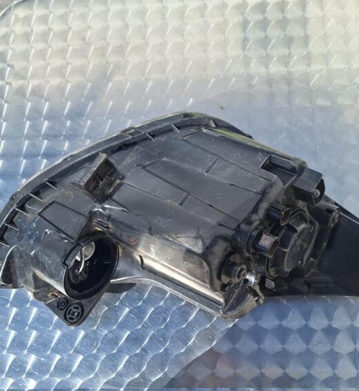 Left side headlight assembly for Hyundai Grand i10 shown from front angle with clear lens and reflector detail