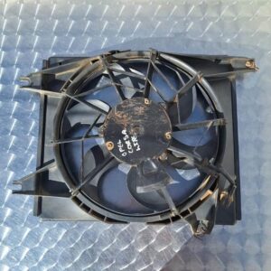 Front view of a new radiator fan assembly angled to show blades and motor housing.Front view of a new radiator