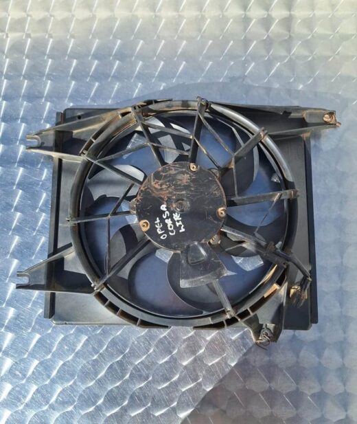 Opel Corsa Lite Radiator Fan Front view of a new radiator fan assembly angled to show blades and motor housing.Front view of a new radiator