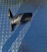Left door mirror for Nissan Sentra, shown from the side, in used condition.Left door mirror for Nissan Sentra,