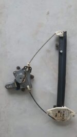Close-up of a car window regulator assembly viewed from the side showing cables and mounting points.Close-up o