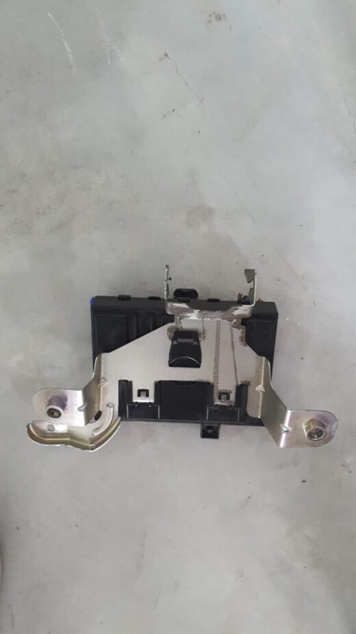 Used car fusebox mounted with multiple relays and fuses visible from a top angled view.Used car fusebox mounte