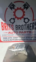 Left front headlight assembly for Isuzu KB, shown from front angle in clean condition.Left front headlight ass