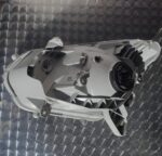 Right-side front headlight assembly for Isuzu KB, angled view showing lens and mounting points.Right-side fron
