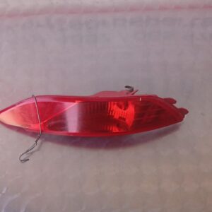 Rear bumper reflector for Hyundai Tucson shown front-facing, used condition.Rear bumper reflector for Hyundai