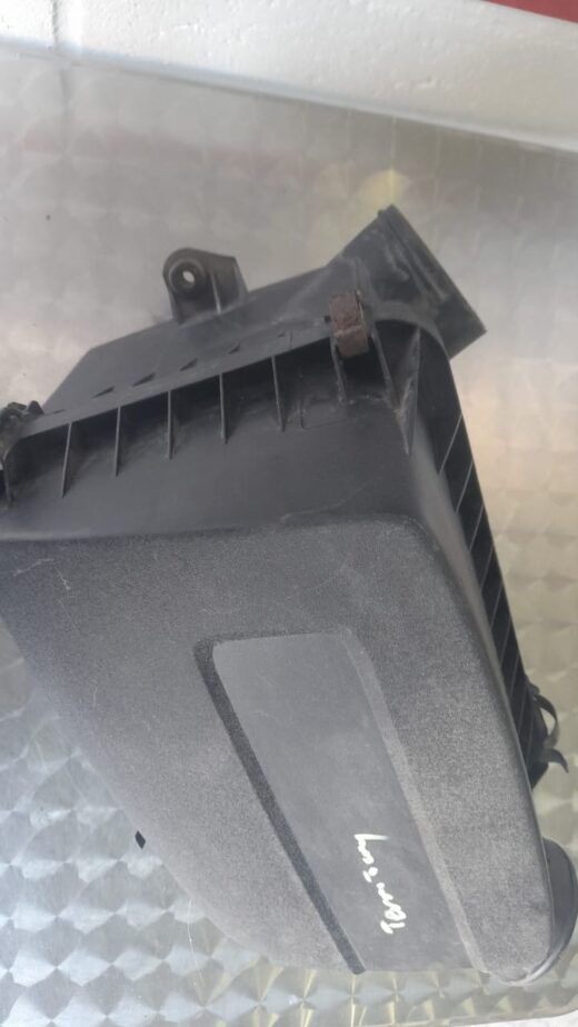 Front view of a black plastic air filter housing for Ford Territory, shown displayed on a plain background.Fro