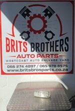 Front angled view of a new black spotlight designed for mounting on a Ford Ranger vehicle.Front angled view of
