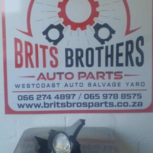 Front view of a used Toyota Hilux spotlight assembly with clear lens and mounting bracket visibleFront view of