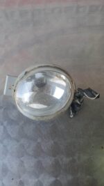 Front left headlight assembly of Hyundai i20 shown from a slightly angled front view in a gallery settingFront