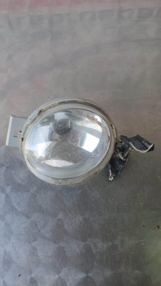 Front left headlight assembly of Hyundai i20 shown from a slightly angled front view in a gallery settingFront