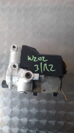 Used ABS pump for Mercedes W202 shown from top angle with visible motor and mounting points.Used ABS pump for
