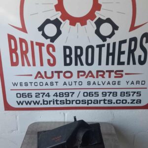 Used air filter housing for Ford Mondeo, angled side view showing mounting points and inlet opening.Used air f