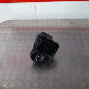 Front angle of a used VW Polo headlight switch showing the knob and connector side clearly.Front angle of a us