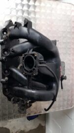Front view of a metal 2L intake manifold with attached sensors and vacuum ports for a Ford Mondeo.Front view o