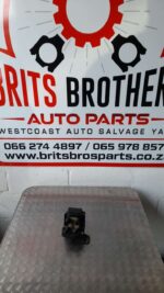 Front view of a 2L coil for a Ford Mondeo displayed on a plain background.Front view of a 2L coil for a Ford M