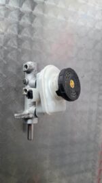 Front-side view of a brake master cylinder for Isuzu KB on a white background.Front-side view of a brake maste