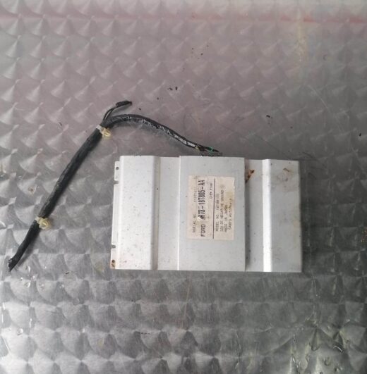 Used car audio amplifier shown from front angle with visible connectors and wiring on the side.Used car audio