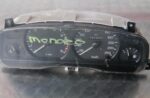 Front view of a Ford Mondeo instrument cluster showing gauges and digital display panel.Front view of a Ford M