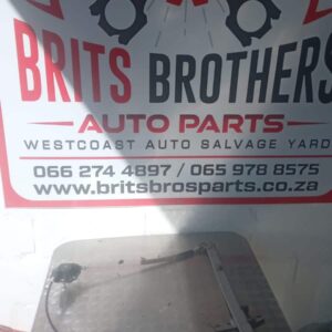 Front view of a VW Caddy window mechanism assembly showing metal frame and gear components.Front view of a VW