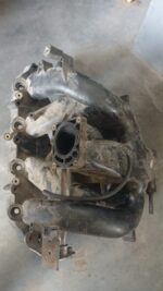 Top-angle view of a clean 2L intake manifold for a Ford Mondeo, shown against a plain white background.Top-ang