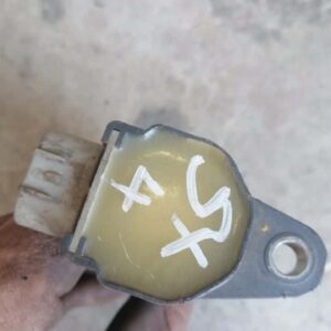 Front angle view of Suzuki Sx4 pencil coil showing black cylindrical shape with attached wiring harness.Front