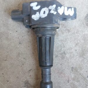 Front view of a clean, new coil spring for a small car suspension system displayed against a plain background.