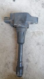Front angled view of a new Datsun Go pencil coil for ignition system replacement.Front angled view of a new Da