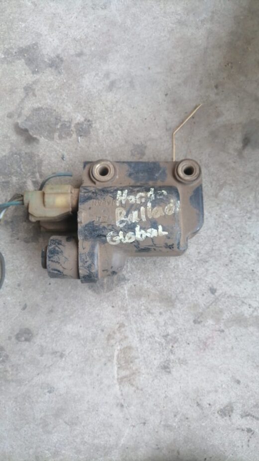 Honda Ballade Coil Whatsapp Image 2023-10-03 At 20.47.20 Front angle view of a car ignition coil for a Honda Ballade on a white background.Front angle view of a car ig