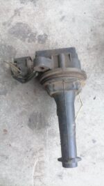 Close-up of a black coil spring for a Volvo, viewed from a slight angle showing its tight coils.Close-up of a