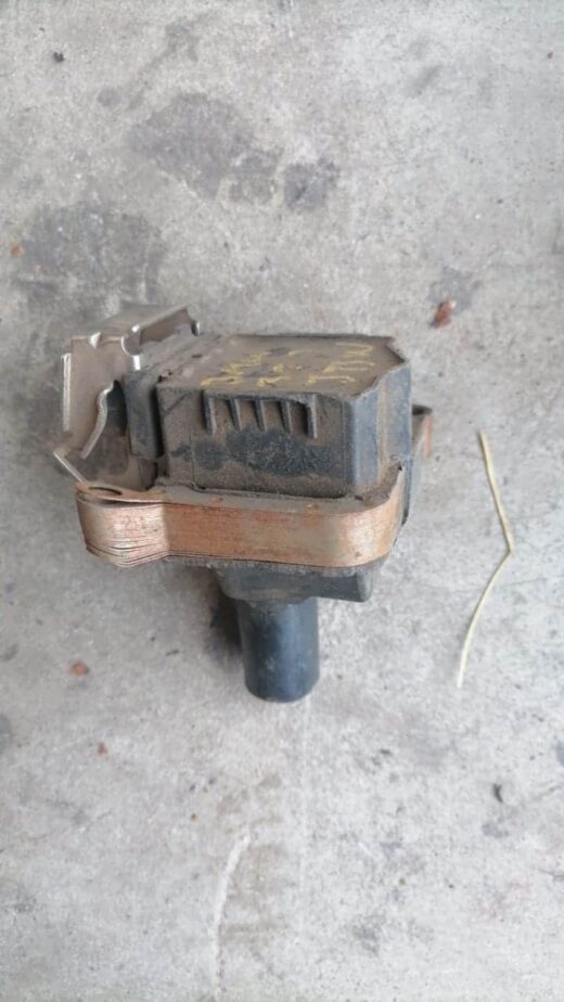 Used BMW E46 coil spring viewed from a side angle showing the full height and mounting pointsUsed BMW E46 coil