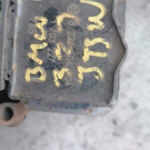 Front angle view of a used BMW E46 coil showing a black cylindrical component with wiring harness attached.Fro