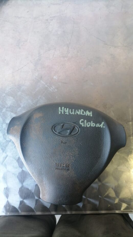 Hyundai Steering Airbag Whatsapp Image 2023-10-03 At 20.47.50 Front view of a Hyundai car steering airbag assembly displayed against a plain background.Front view of a Hyun