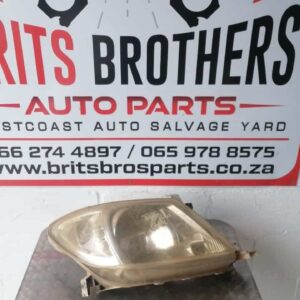 Right headlight for 2008 Toyota Hilux shown from front angle, clear lens and intact housing visible.Right head