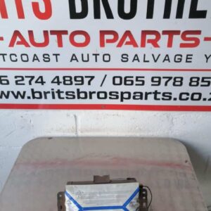 Front view of Renault Megane dashboard airbag assembly showing central cover and wiring harness.Front view of