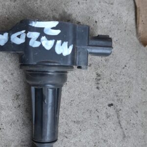 Front-facing view of a single pencil coil for Mazda 2, showing electrical connector and coil body.Front-facing