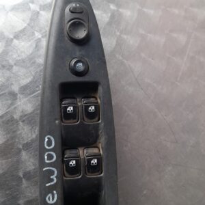 Front view of a used Daewoo car window switch panel with multiple buttons and toggle controls.Front view of a