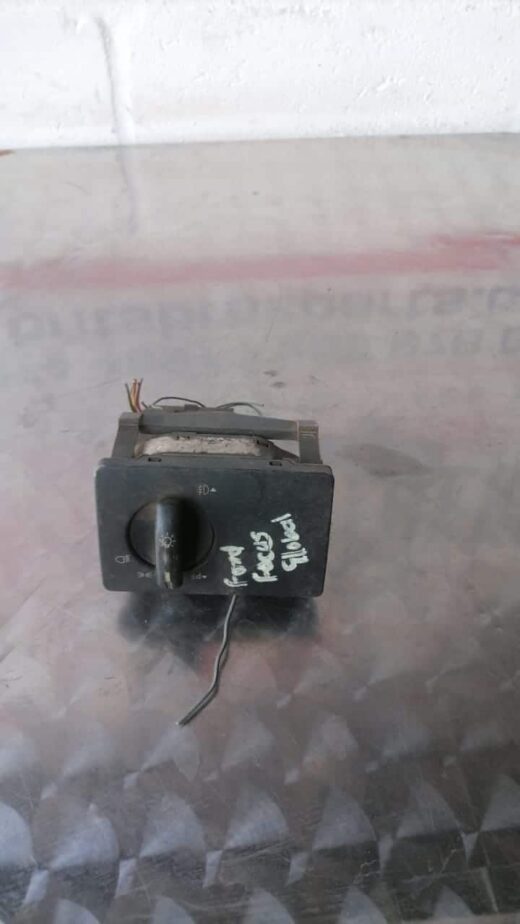 Ford Focus Headlight Switch Used Ford Focus headlight switch shown front facing, with visible control knob and connector pins.Used Ford Fo