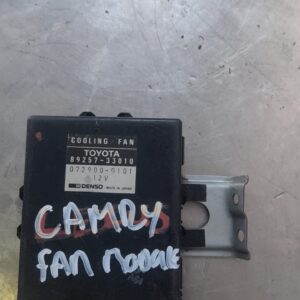 Front angle of a radiator fan module for Toyota Camry, used condition, showing wiring and mounting points.Fron