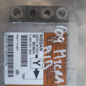 Front view of a Nissan Micra airbag module showing connector and mounting points, featured image.Front view of
