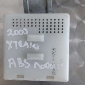 Front angled view of a car ABS module against a white background.Front angled view of a car ABS module against