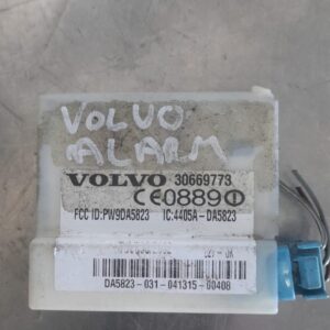 Front view of Volvo XC90 alarm sensor control module showing label and wiring connector.Front view of Volvo XC