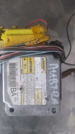 Front view of a Daewoo Nubira airbag control unit with wiring harnesses attached.Front view of a Daewoo Nubira