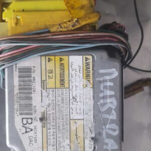 Front view of a Daewoo Nubira airbag control unit with wiring harnesses attached.Front view of a Daewoo Nubira