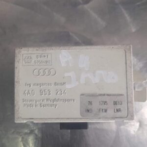 Front view of an Audi A4 B5 immobiliser ECU unit with connector ports and metal casing.Front view of an Audi A